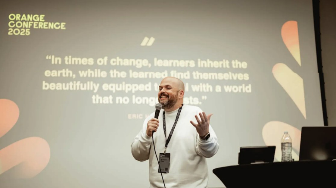 Brandon speaking at Orange Conference 2025