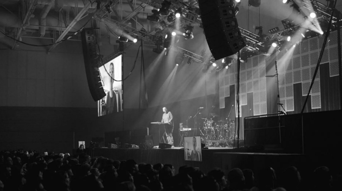 Brandon on stage in a large arena